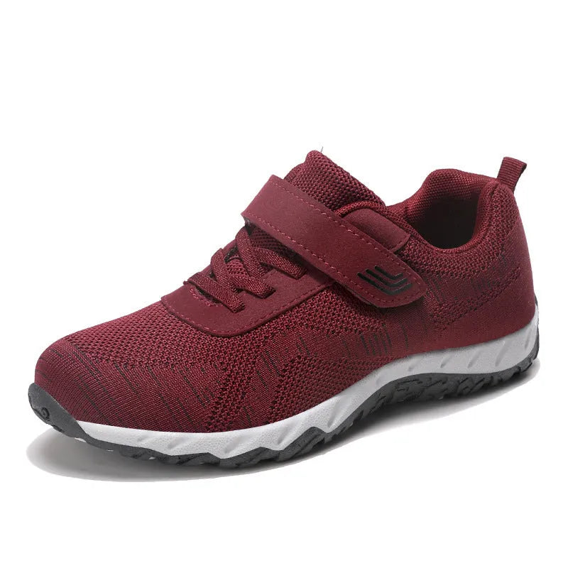 Women's gray purple low-top casual shoes with velcro strap and wedge heel.
