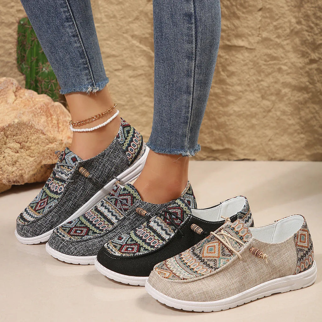 Women's flat round toe casual shoes in black, dark grey, or khaki with a low-top design and rubber sole.
