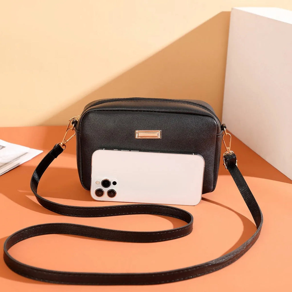 Solid colour women's PU shoulder bag with three-dimensional pocket design in urban simple style