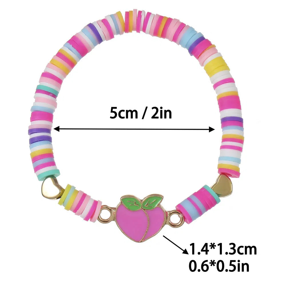 Children's polymer clay bracelet with dinosaur bead theme on a white background