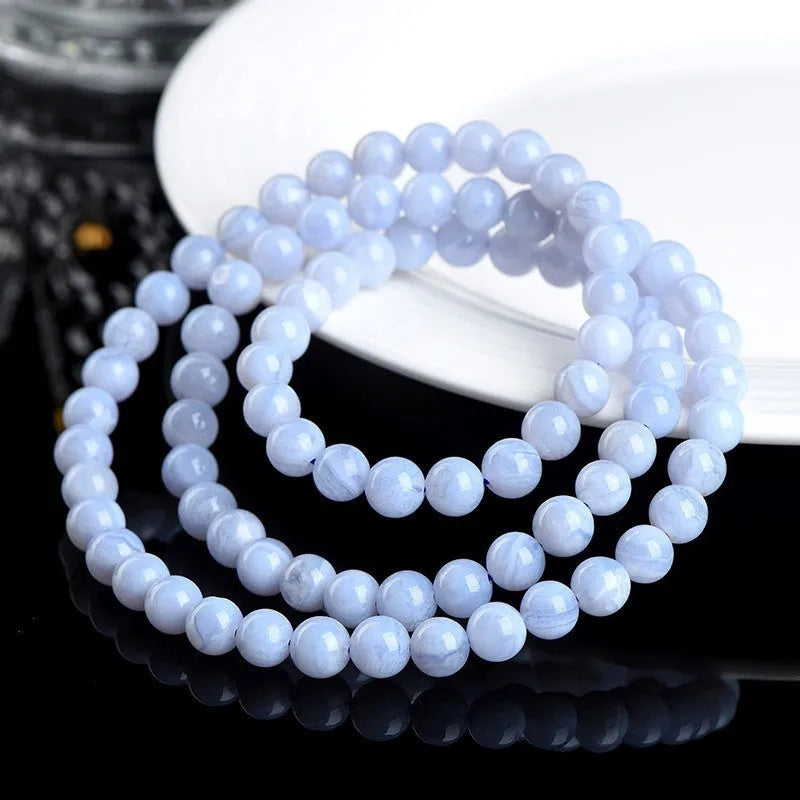 Blue agate bracelet with natural multi-circle pattern and Ruyi elements on wrist