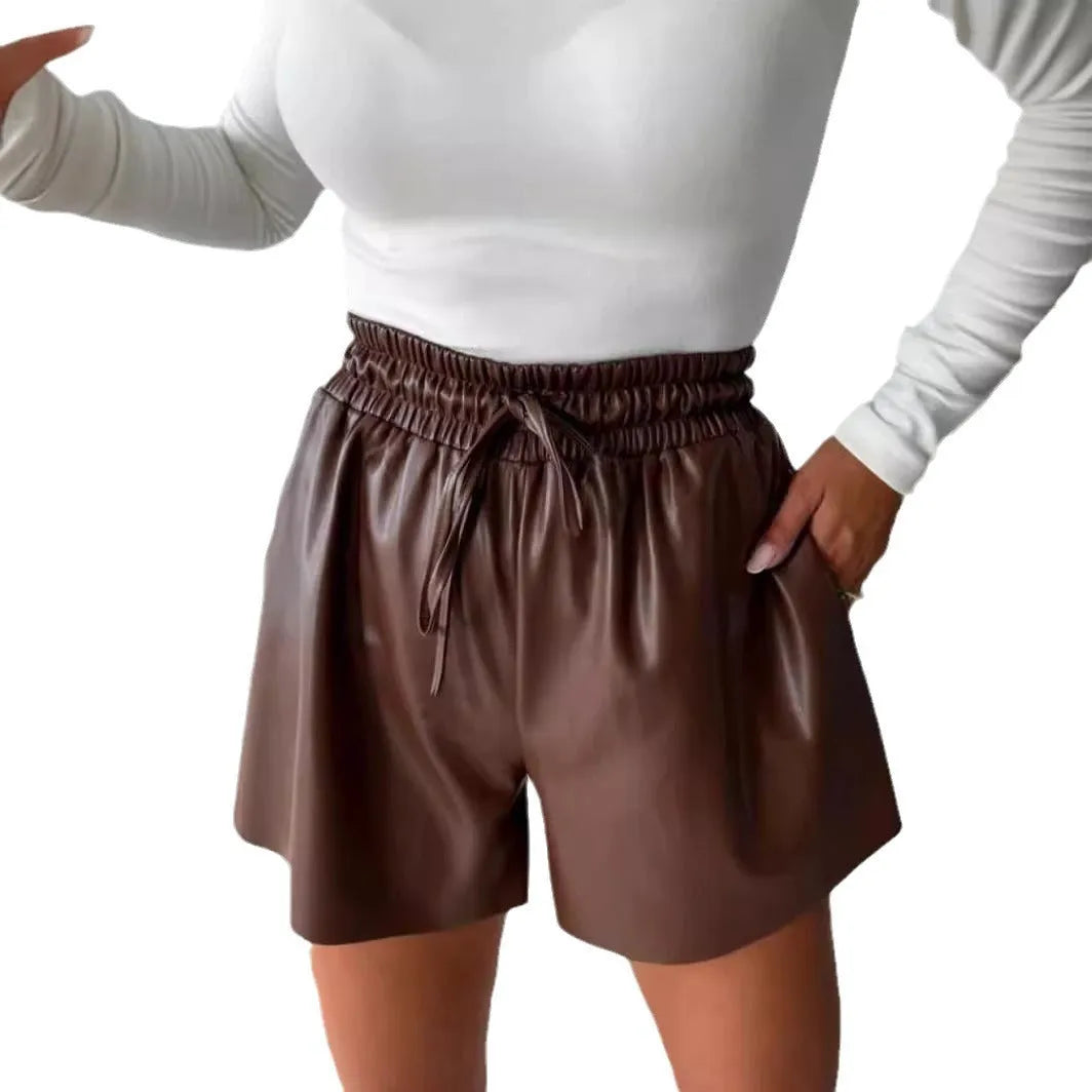 Women's black drawstring lace-up PU leather wide-leg casual shorts on a hanger.