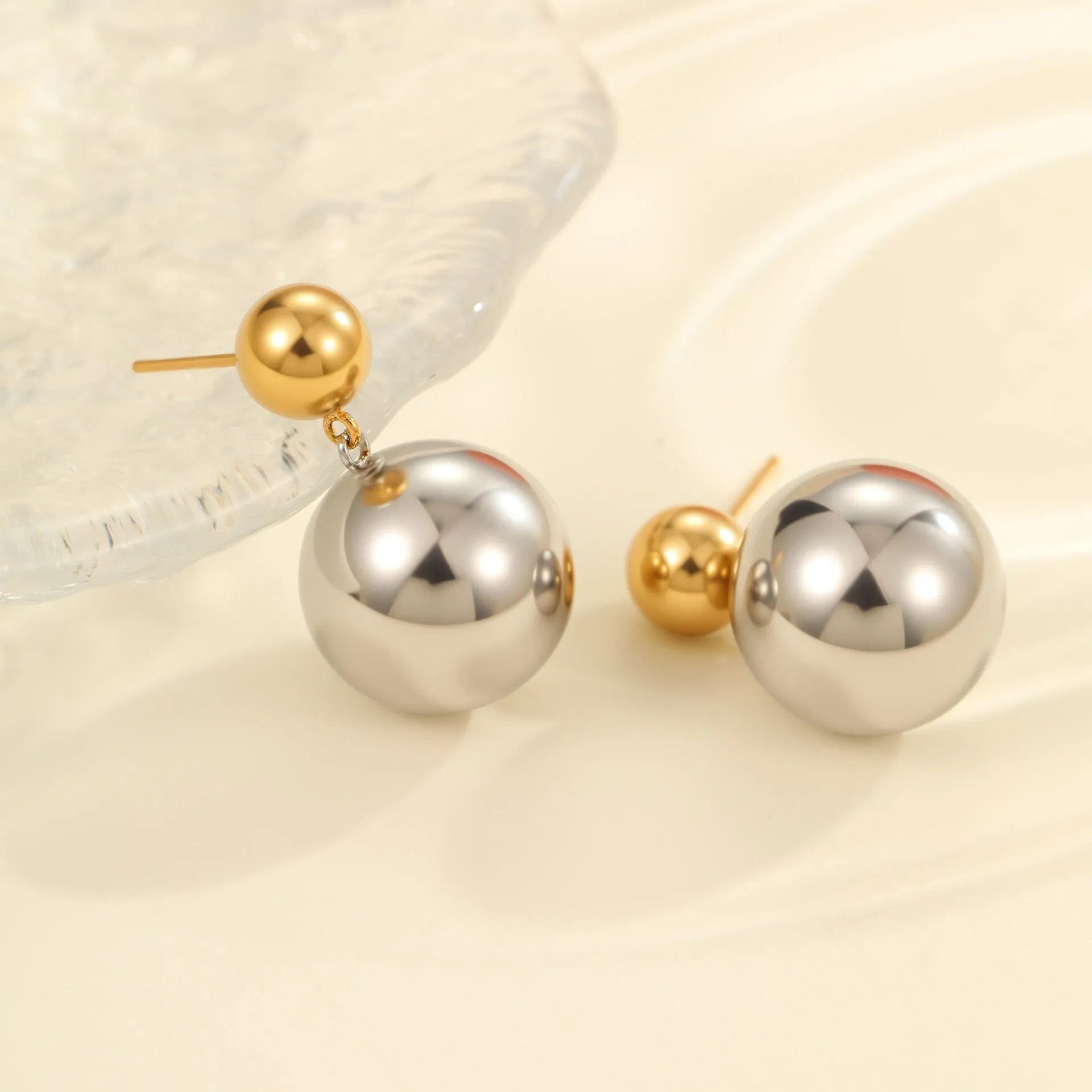 Stainless steel ear studs with round beads and colour-block design