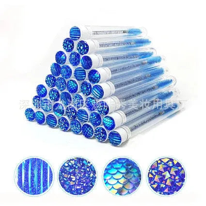 Disposable eyelash brushes in blue, green, pink and purple colours with transparent protective storage tubes