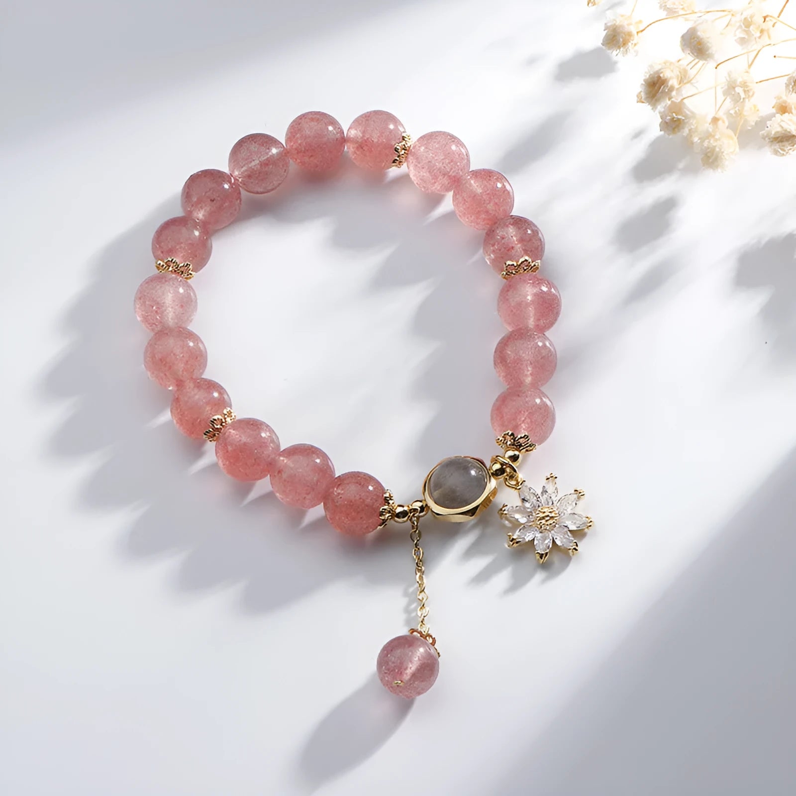 Korean style strawberry quartz bracelet with floral charm and silver accents