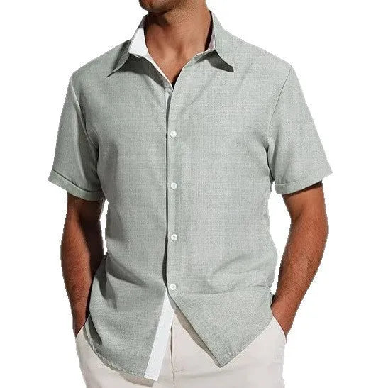 Men's short-sleeved floral shirt in polyester fabric showing regular fit and cardigan styling