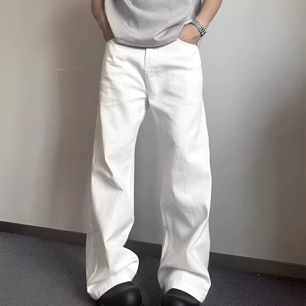 Men's white straight-leg wide-leg cotton denim jeans on a plain background.