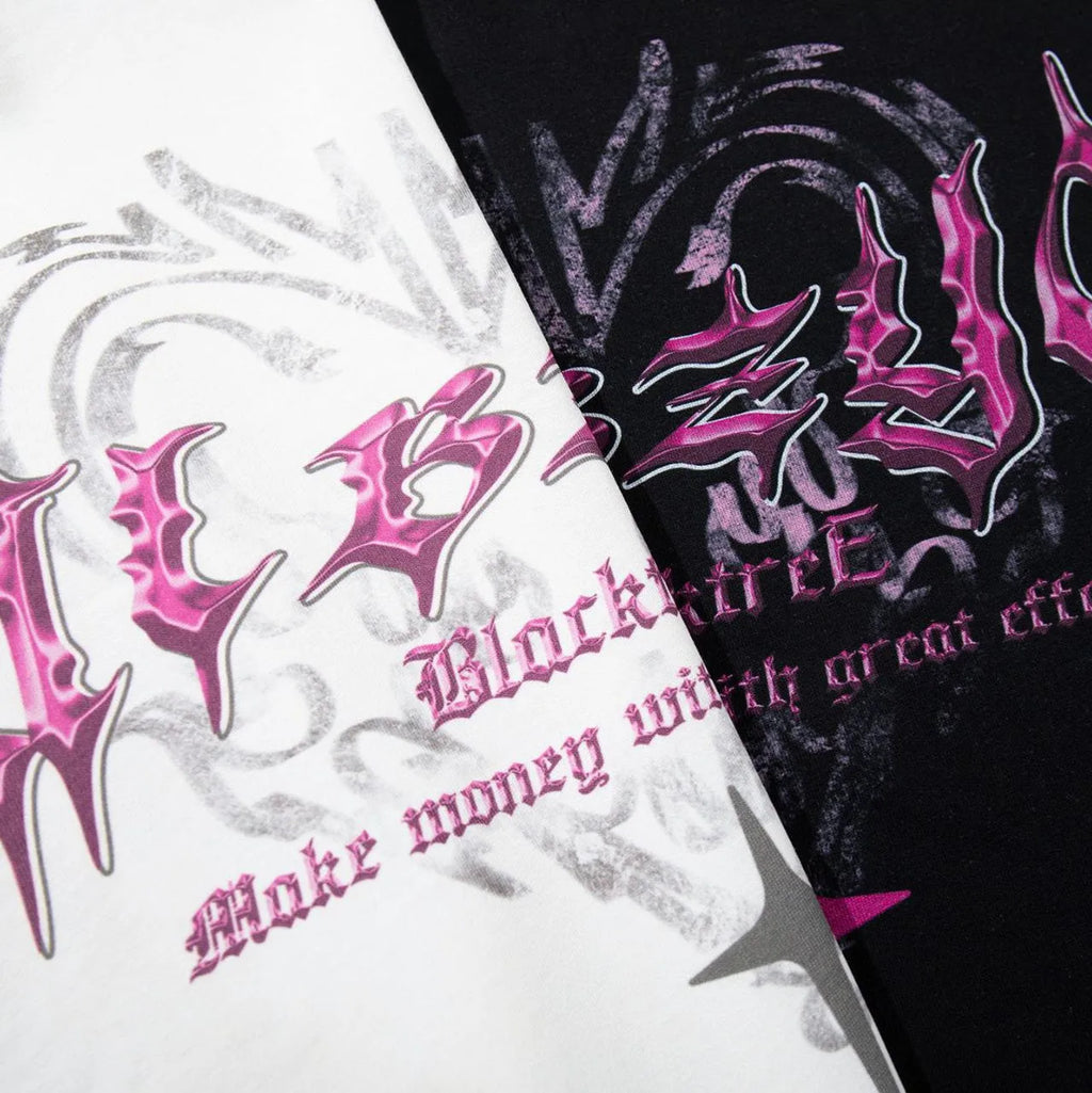 Man wearing a black loose-fit cotton t-shirt with a retro graphic print on the front.