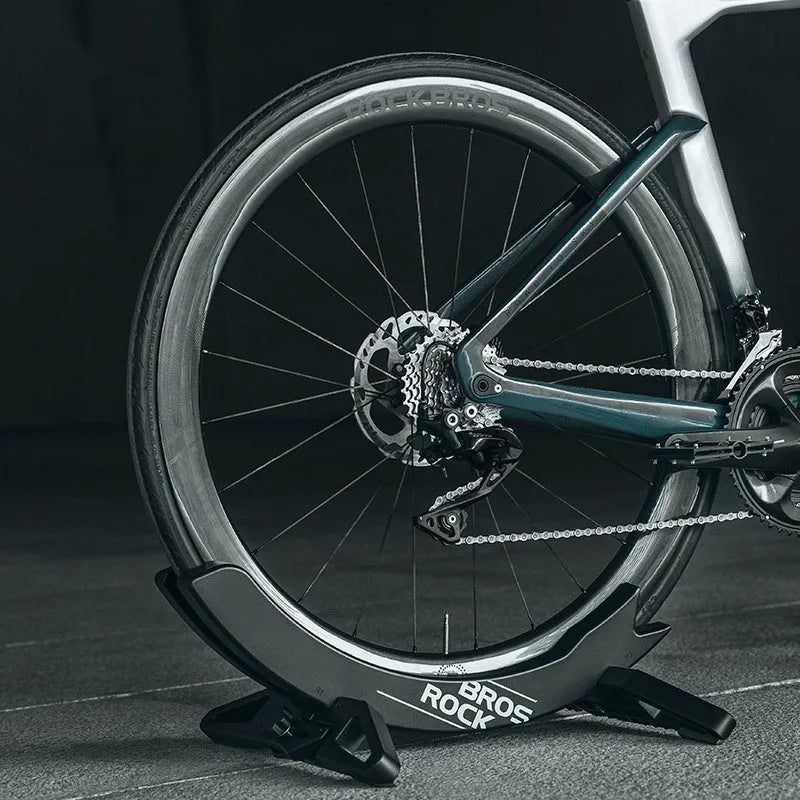 Black and green ABS plastic bicycle wall mount parking rack holder with fixed bracket.