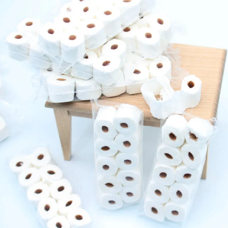 Small white simulated toilet paper roll model for children's educational toy play.