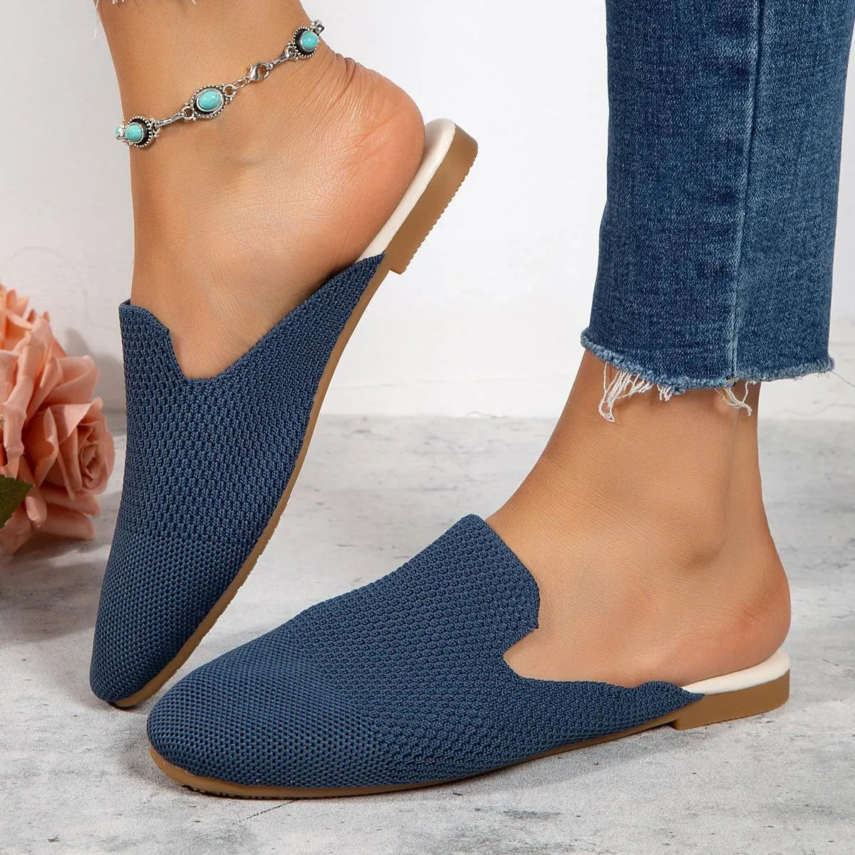 Apricot coloured mesh slip-on sandals with a round toe and flat rubber sole.