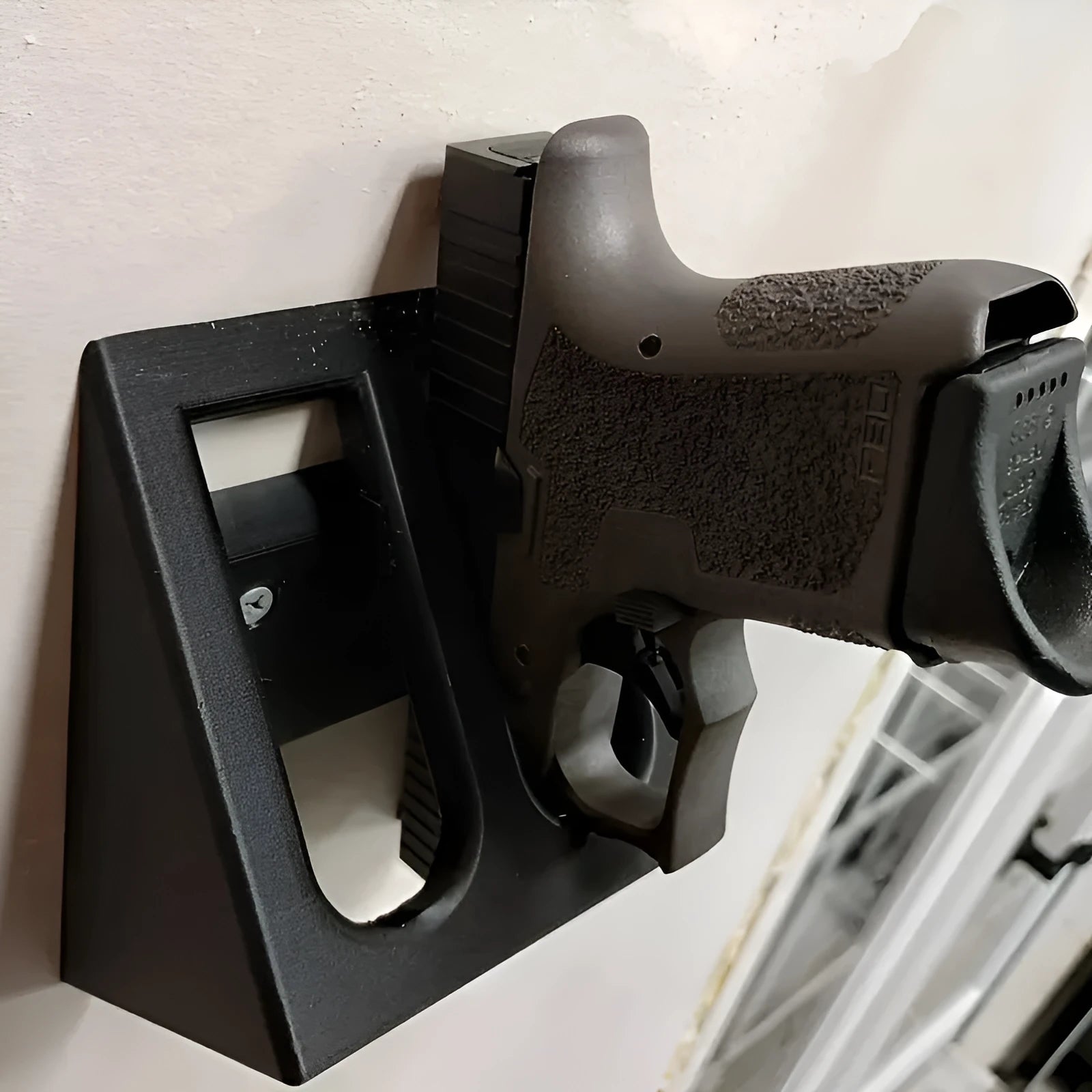 Black plastic pistol display stand for Nerf guns and collectible firearms