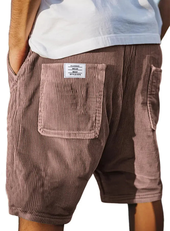 Men's grey straight-leg corduroy shorts with multiple pockets and embroidery detail on a hanger.