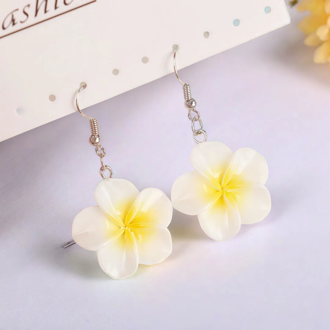 Handmade plastic resin earrings shaped like plumeria rubra flowers in a pair with multiple colour options