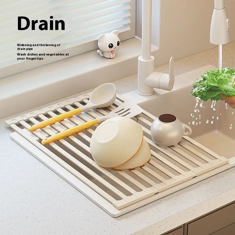 Milky white foldable stainless steel kitchen draining rack shown over a sink.