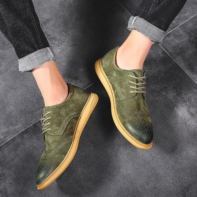 Men's black leather low-top lace-up business shoes with a rubber sole on a plain background.