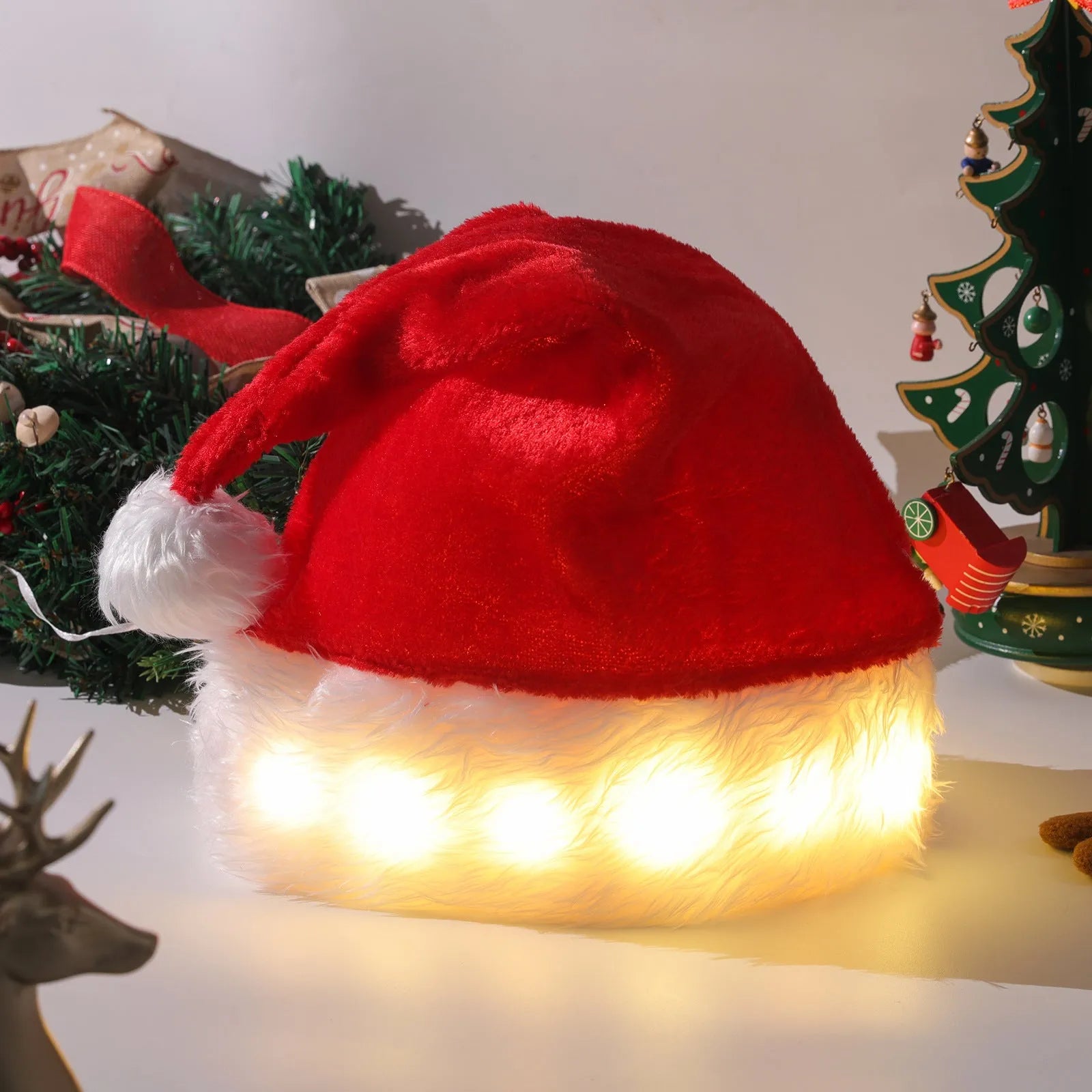 Red and white LED light up Santa hat with multicolour lights and pom-pom