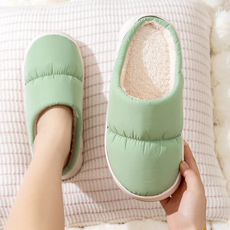 Down cotton winter slippers with artificial leather upper, thick rubber sole, and plush lining in blue colour