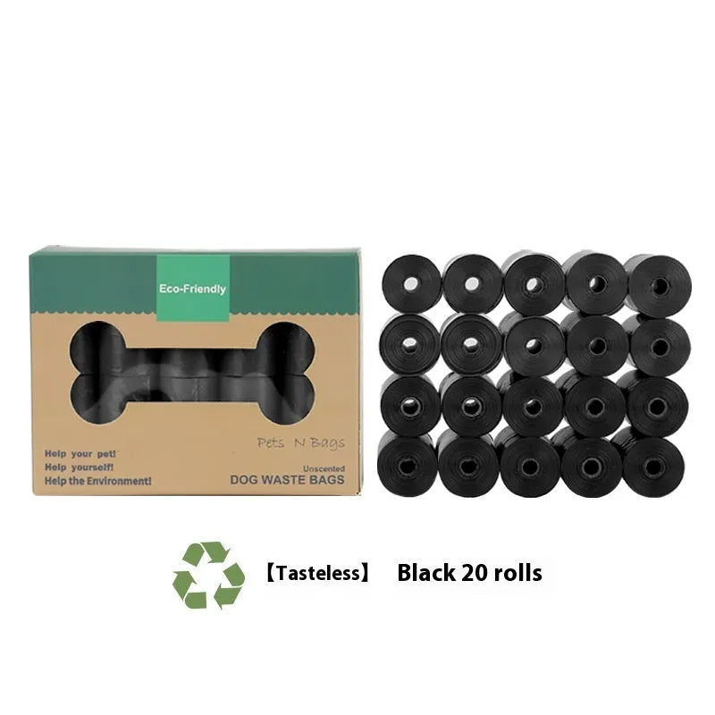 Roll of green EPI degradable dog poo bags next to a white plastic dispenser on a grass background.