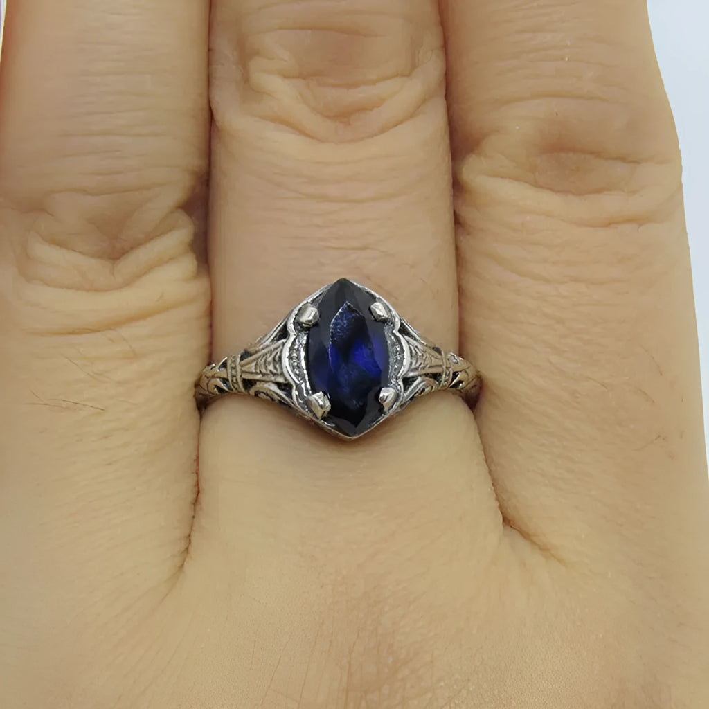 Women's geometric hollow ring in silver electroplated alloy showing openwork pattern