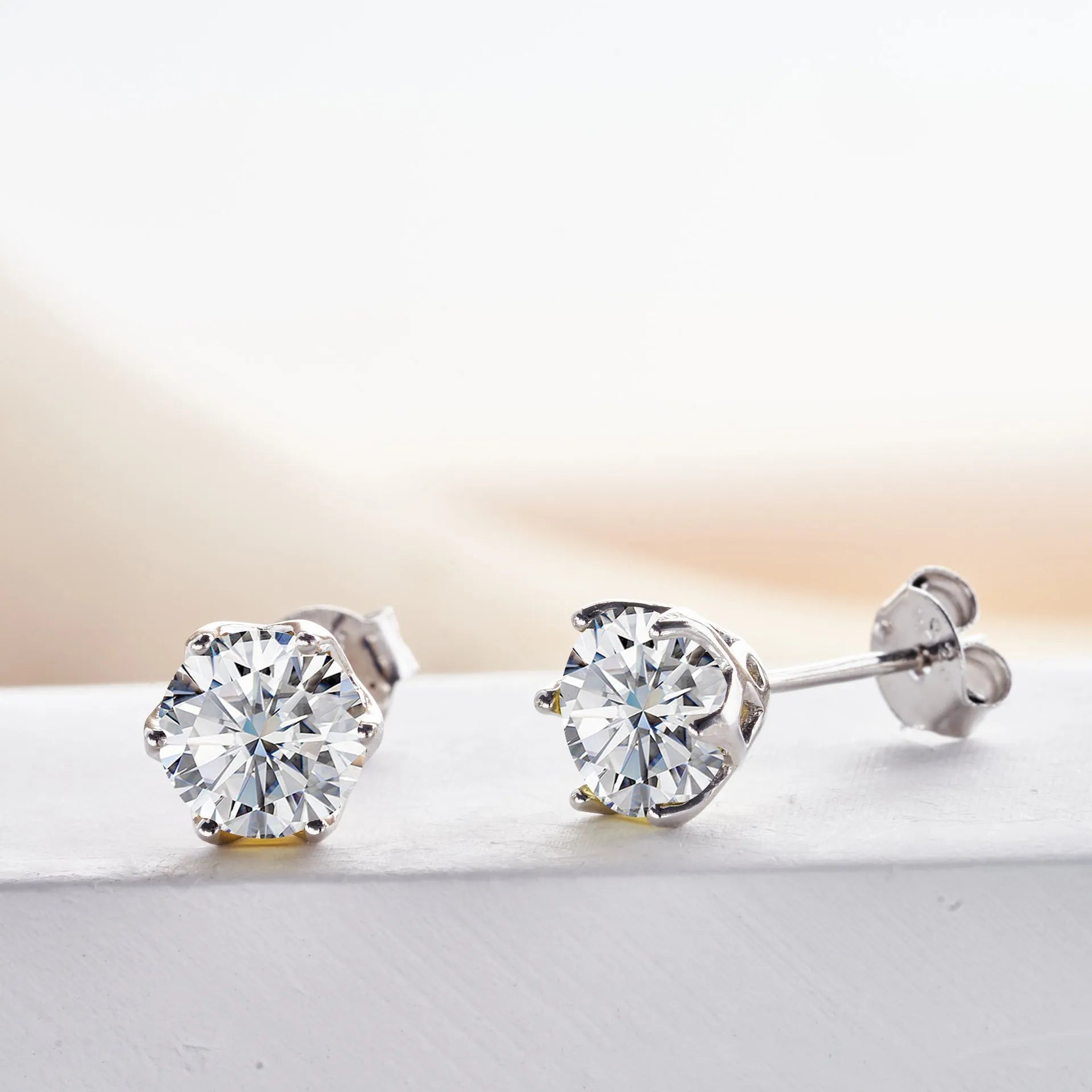 Micro inlaid moissanite stud earrings in S925 sterling silver with round natural stones, unisex design, 1CT per pair