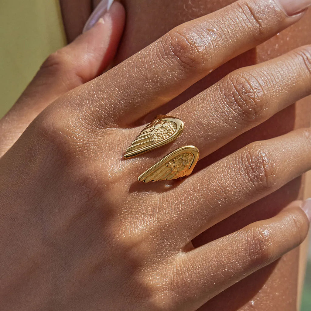 Adjustable stainless steel ring with angel wing ornament in electroplated non-fading finish