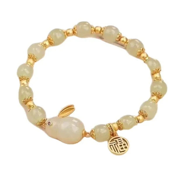 Women's green lucky jade hare bracelet with black elasticated cord