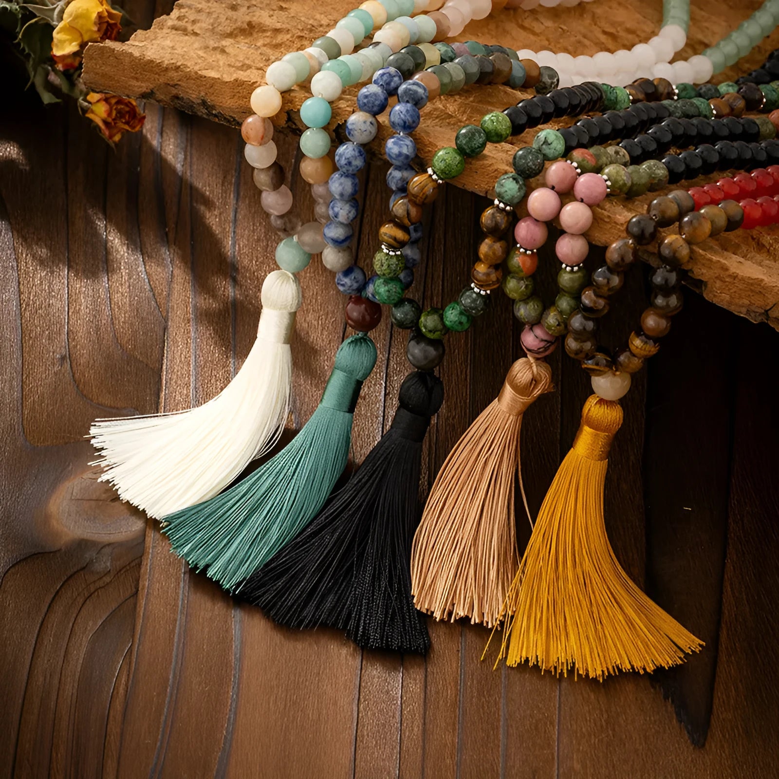 Vintage bohemian long necklace with geometric stone beads and tassel, shown with a matching shorter bracelet.