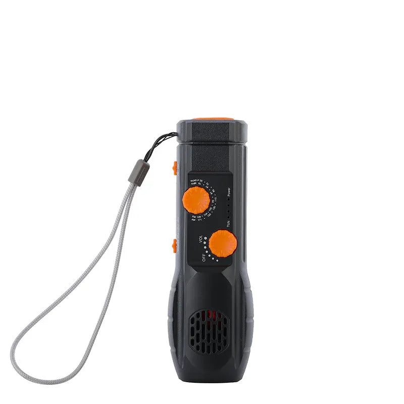 Hand-cranked emergency radio flashlight with USB charging port built-in speaker and manual tuning dial in black
