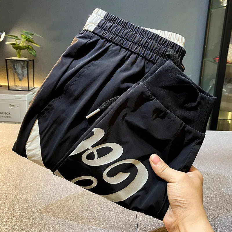 Black men's cropped trousers with elasticated ankle bands in ultra-thin ice silk cotton fabric