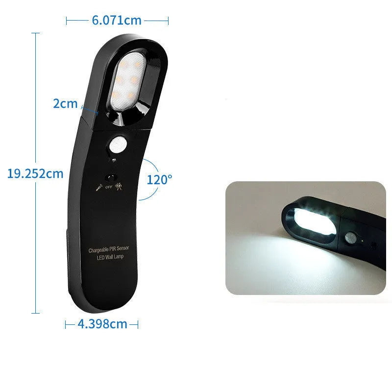 USB human body induction night light with light control, black colour, warm style LED lamp on bedside table