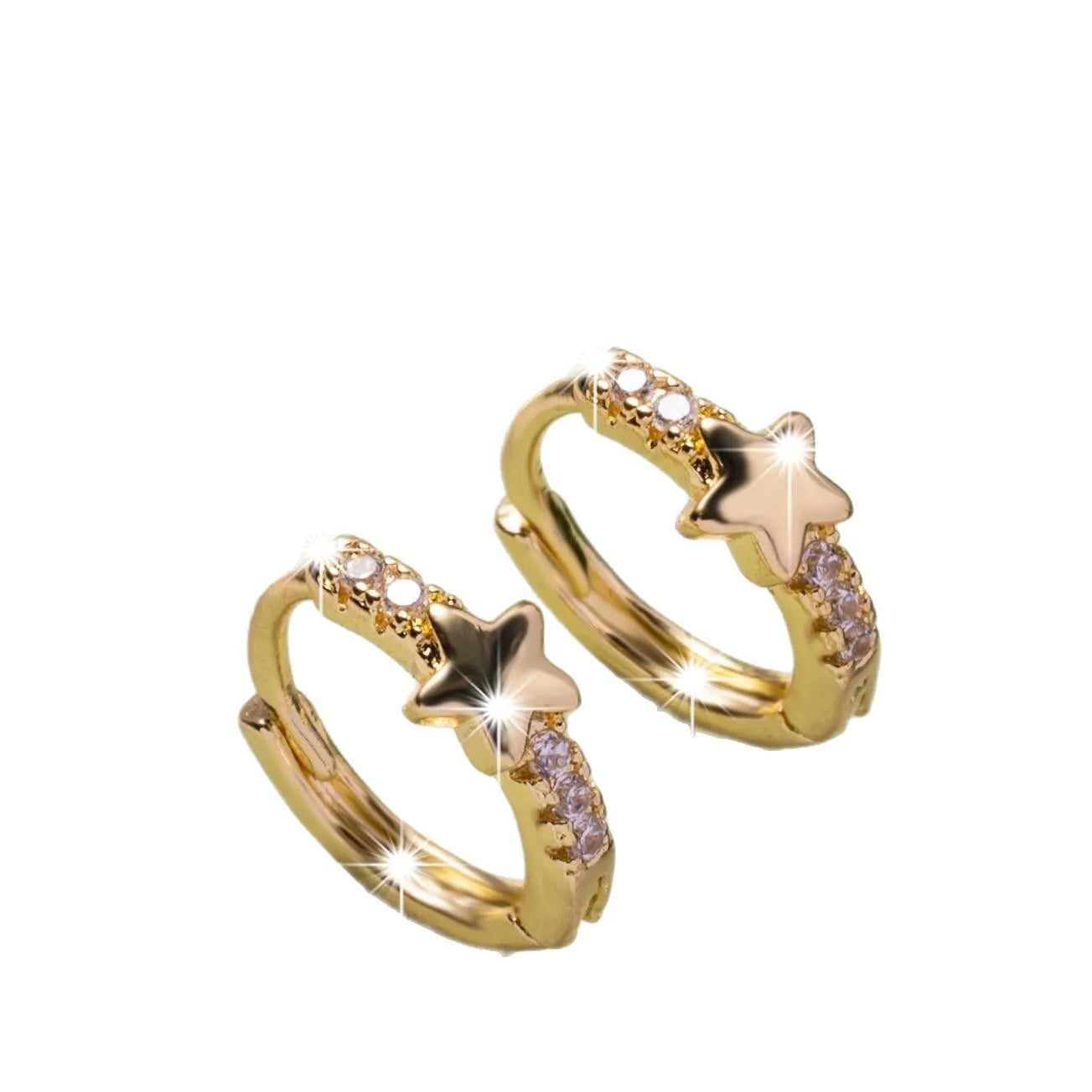 Gold copper five-pointed star earrings with inlaid zircon stones on a neutral background