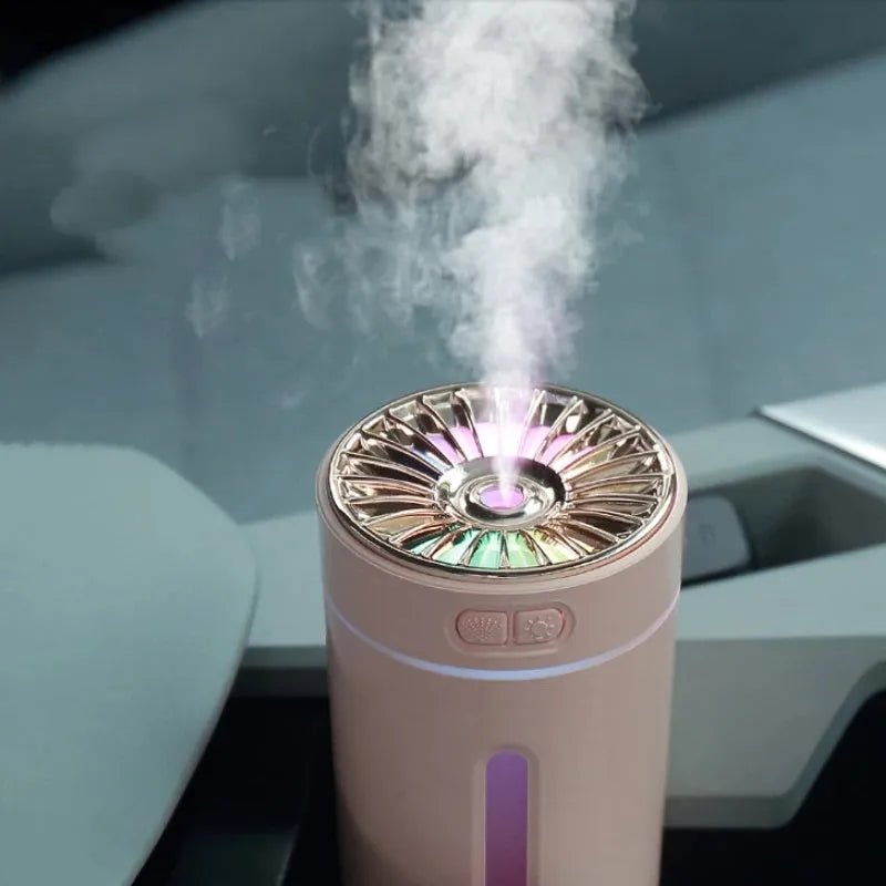 Black and white rechargeable USB humidifier with colourful lights for car and desk use.