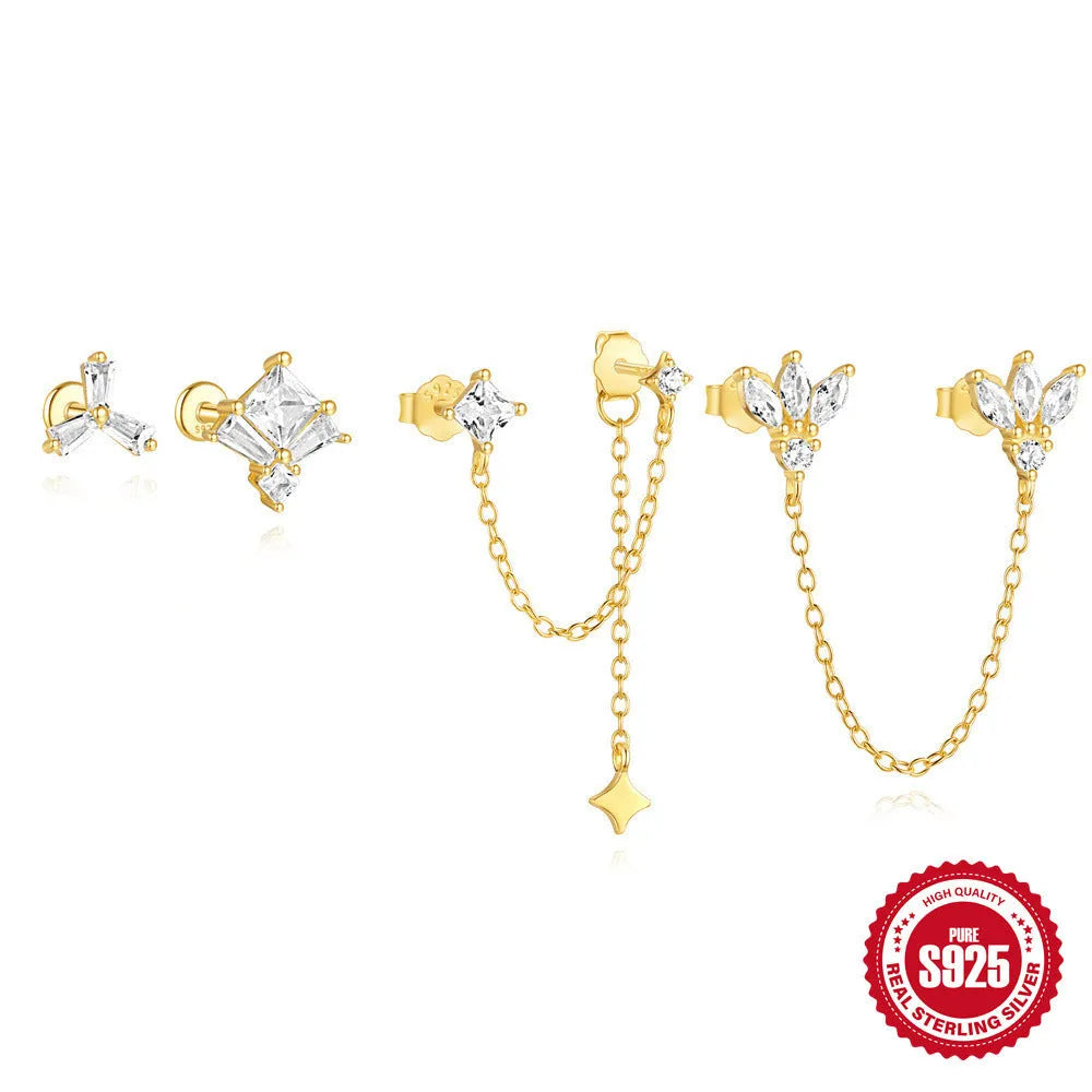 Golden geometric S925 sterling silver stud earrings with zircon inlays, showing clover, crown, and chain horse eye designs.