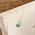 Women's coloured glaze skirt pendant necklace with joker design on cotton linen clavicle chain
