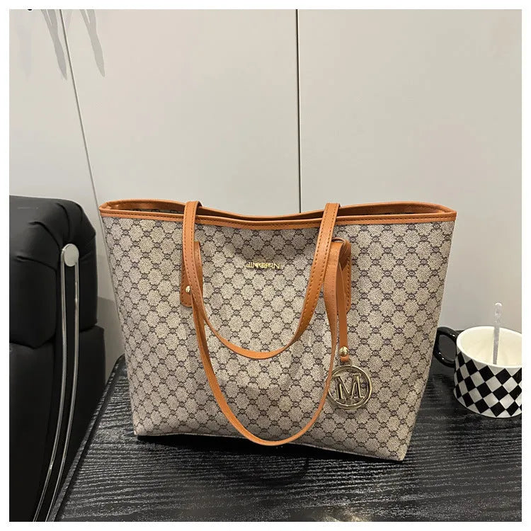 Black PU leather street-style shoulder bag with sewing thread detail, shown next to grey, brown, and white colour options.