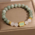 Women's oil green emerald crystal bracelet with five scripture bead design on wrist