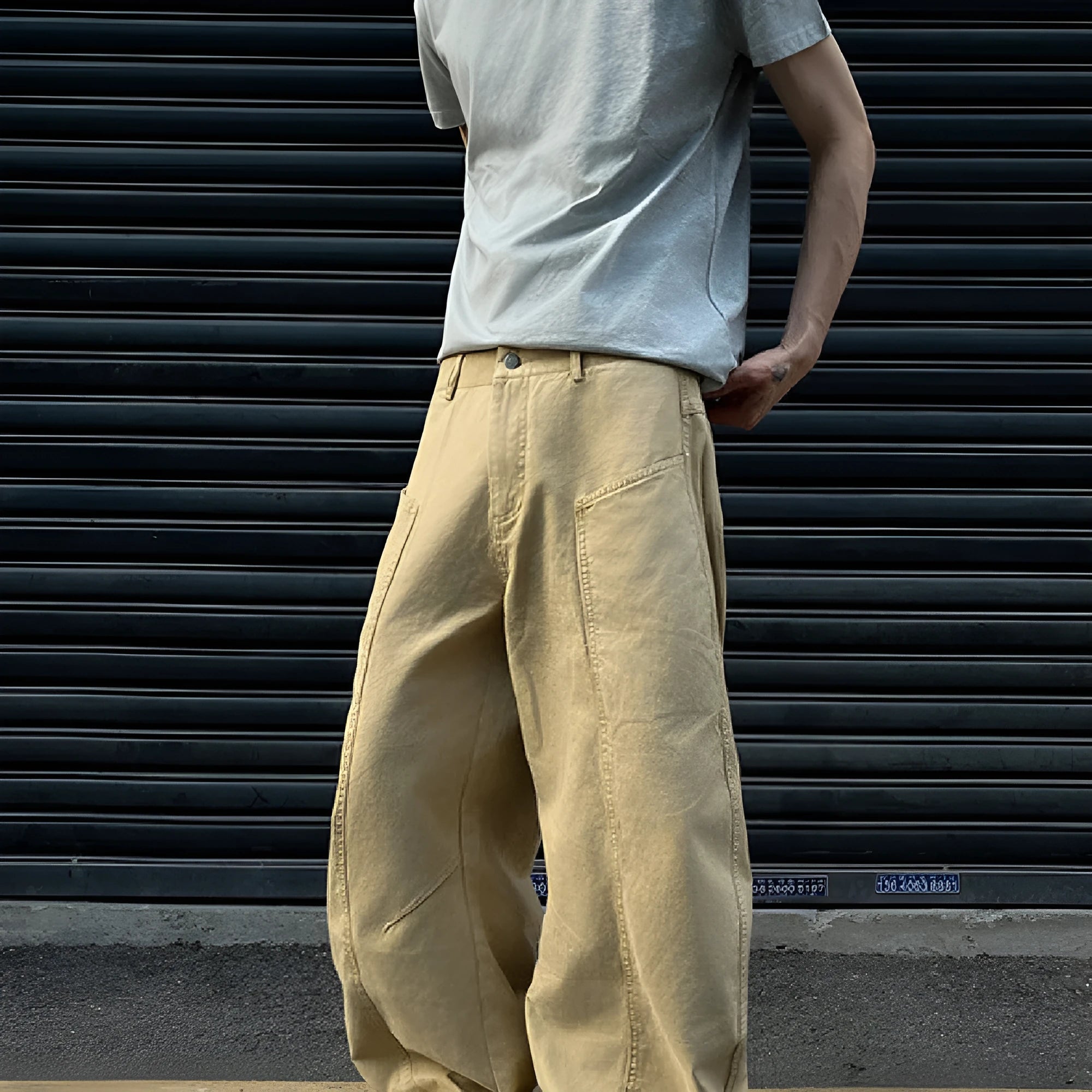 Men's khaki coloured straight-leg cotton casual trousers laid flat