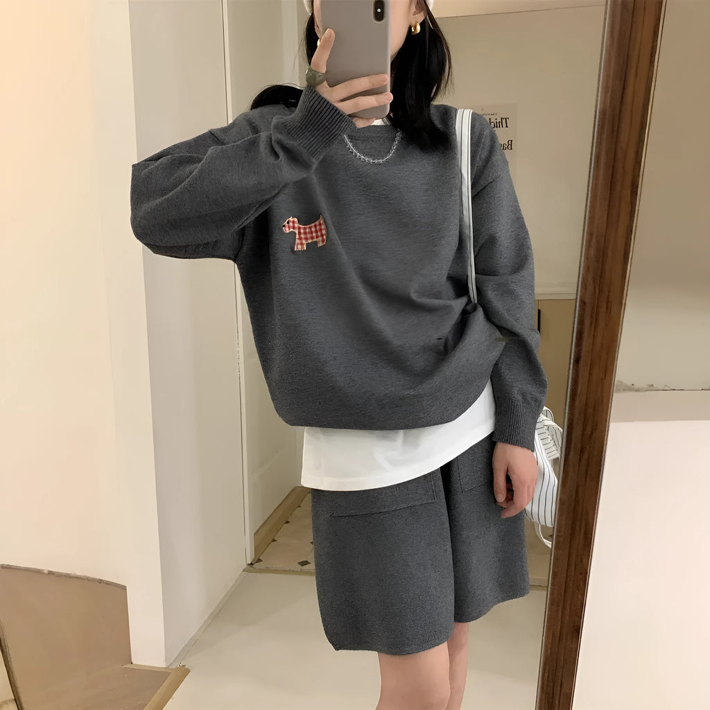 Women's milk blue knitted sweater and shorts set with animal embroidery pattern.