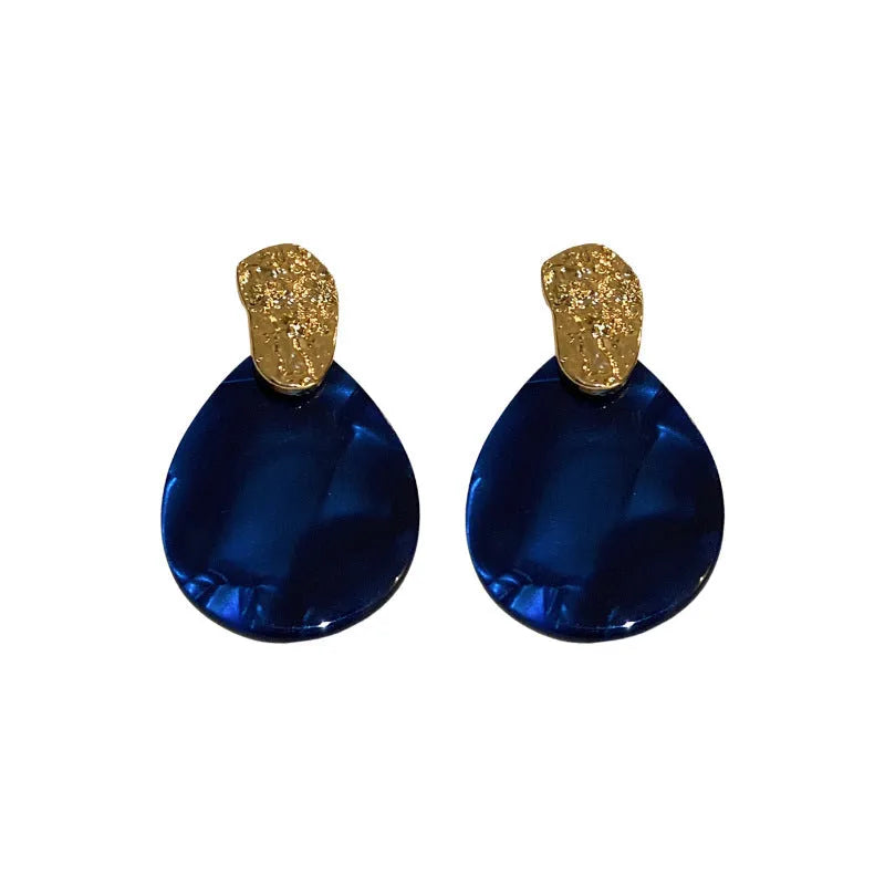 Silver Needle blue acrylic water drop ear studs with pleated texture on white background