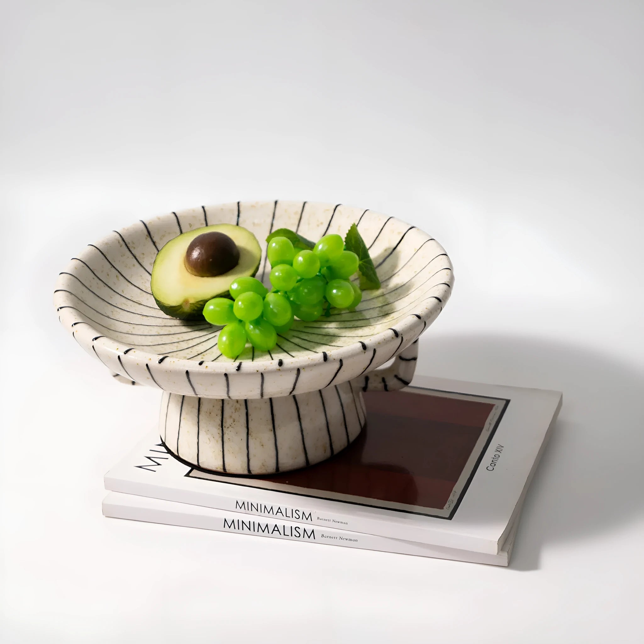 Black and white striped synthetic resin fruit plate or dessert plate on a table