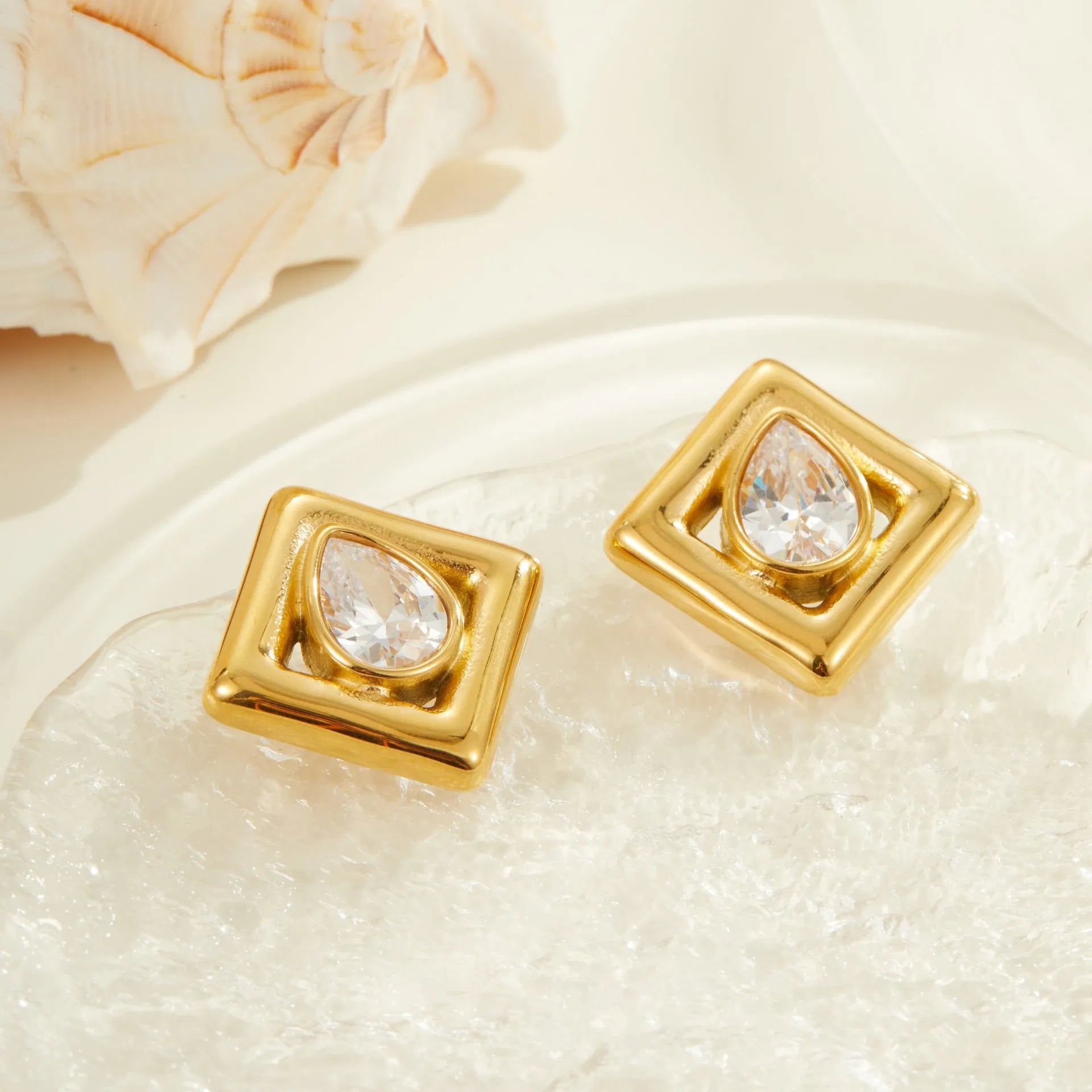 Gold geometric water drop stud earrings with inlaid zircon stones on stainless steel