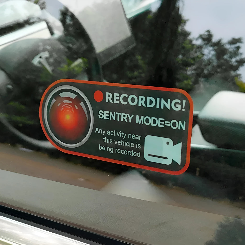 Tesla Sentry Mode warning sticker measuring 11x5 cm with electrostatic backing for window application