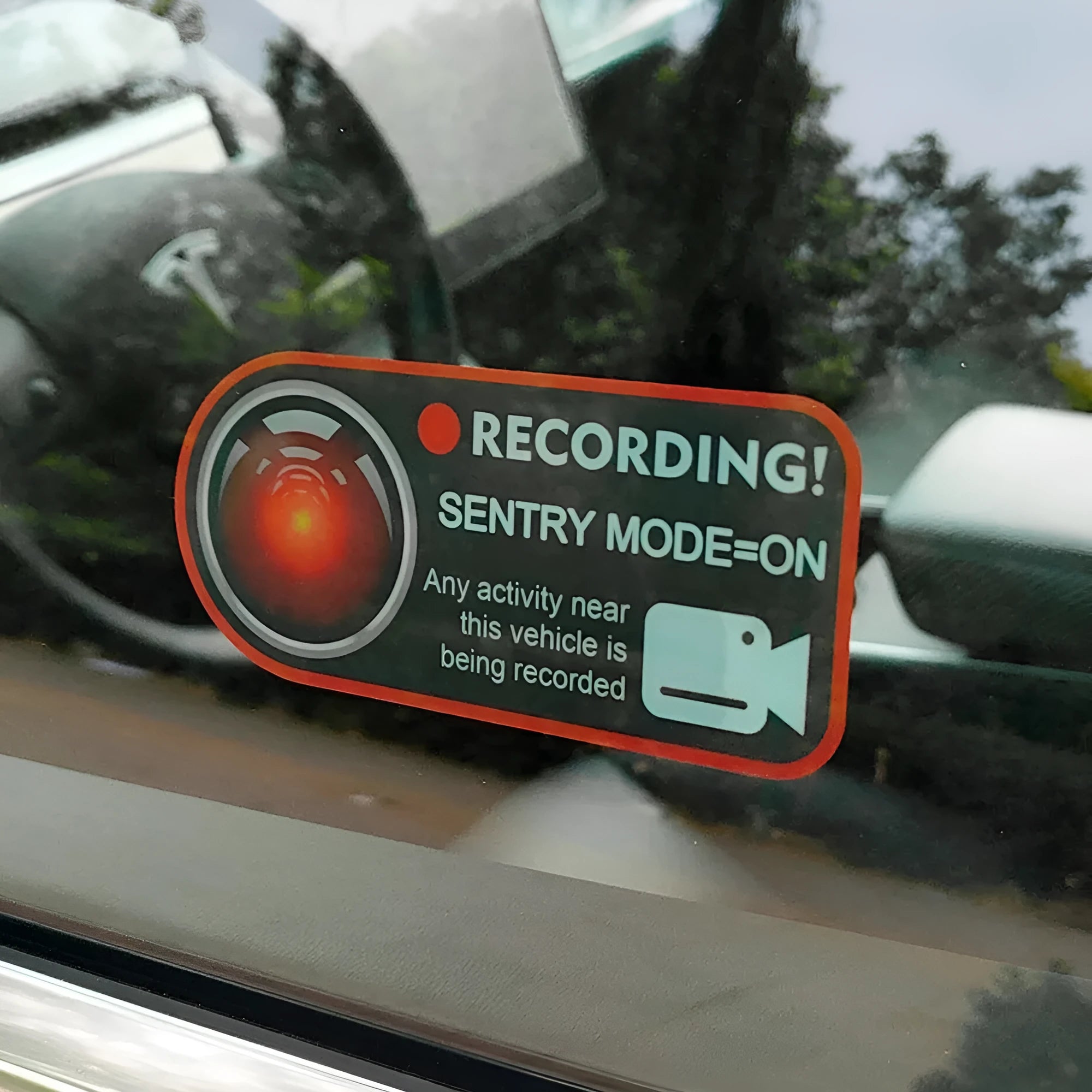 Tesla Sentry Mode warning sticker measuring 11x5 cm with electrostatic backing for window application