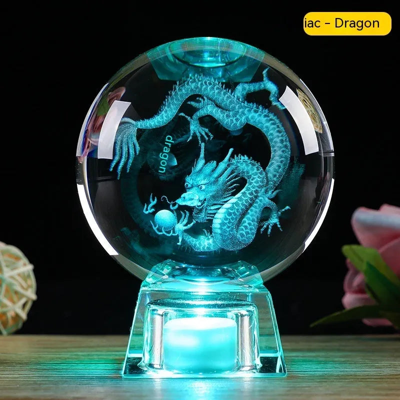 White crystal zodiac decorative ball with electronic base lighting showing Chinese-style animal design