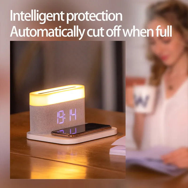 Modern black and white wireless charging desk clock with integrated night light and table lamp.