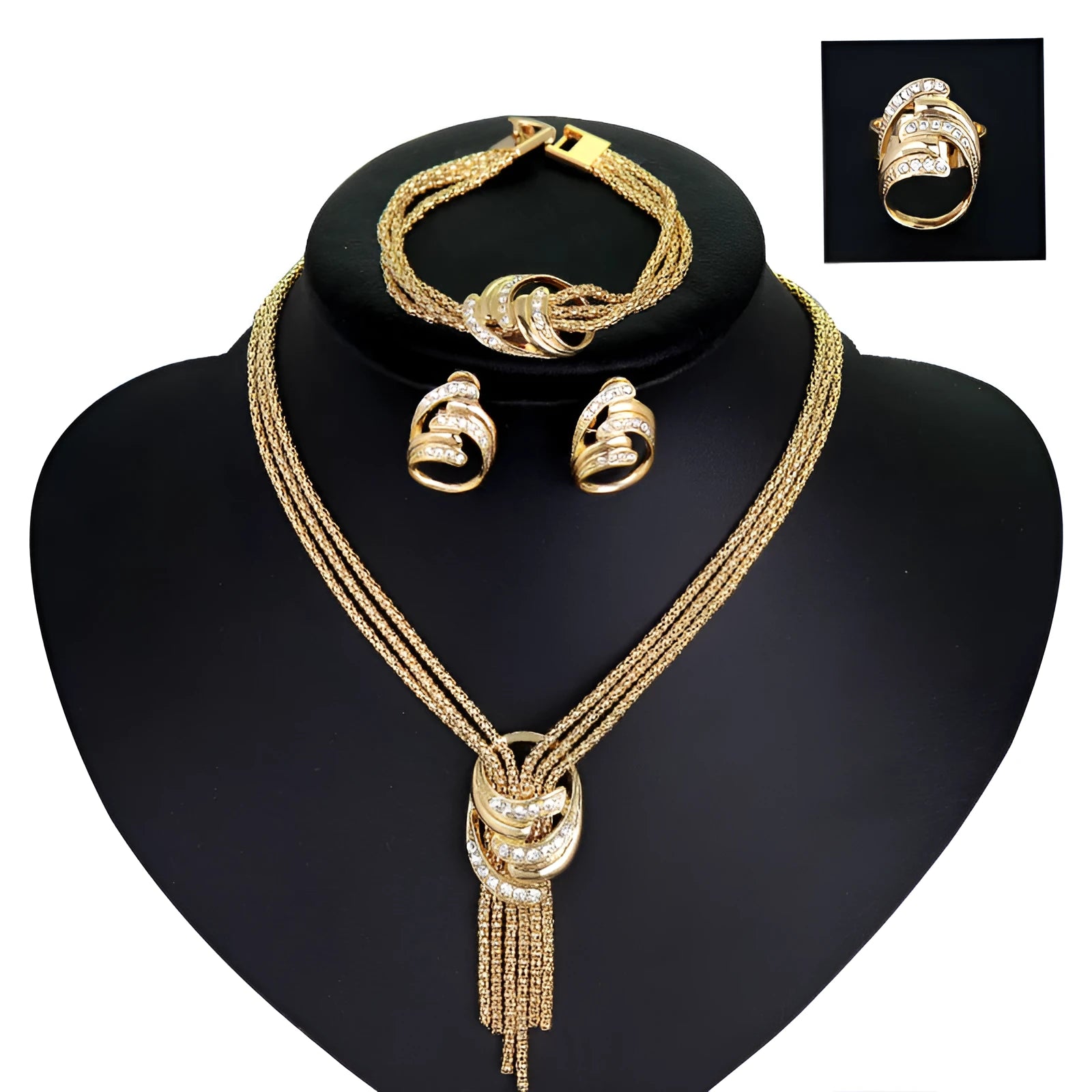 Gold alloy jewelry set with necklace, bracelet, earrings, and ring on a neutral background