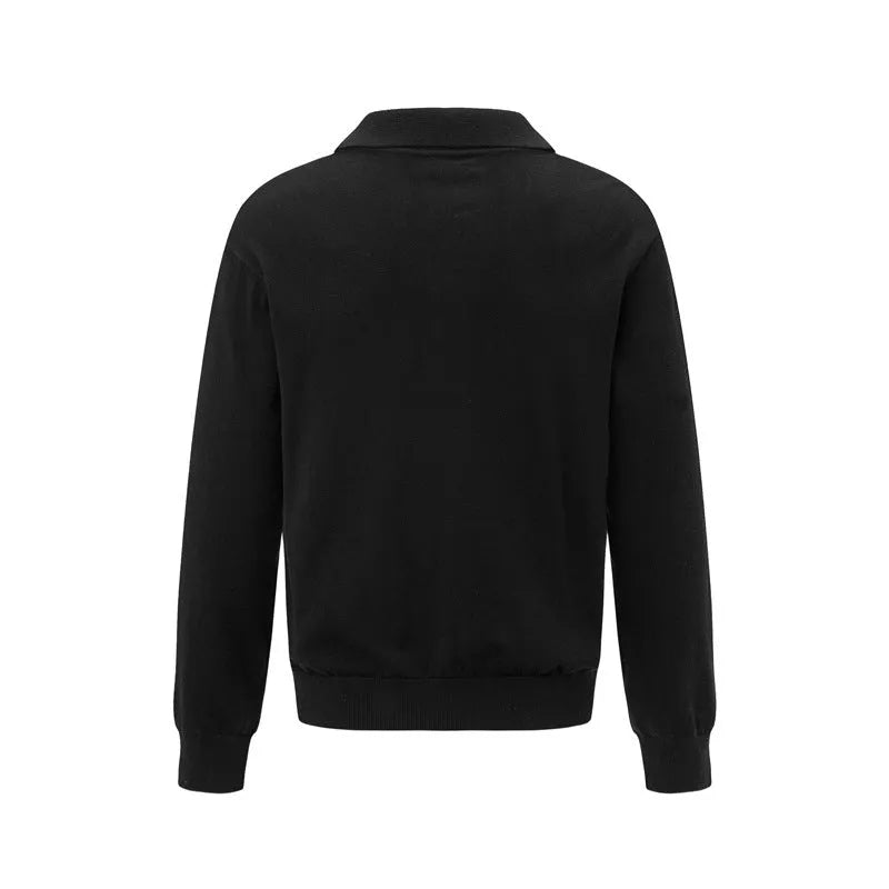 Loose fit black acrylic blend pullover sweater on a hanger.