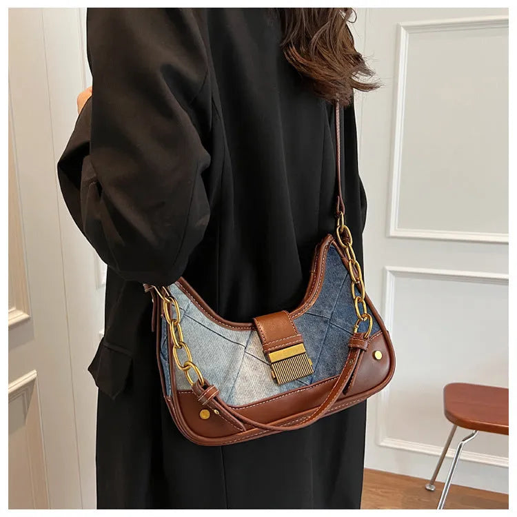 Women's brown denim shoulder bag with diamond chain accents and bucket shape design