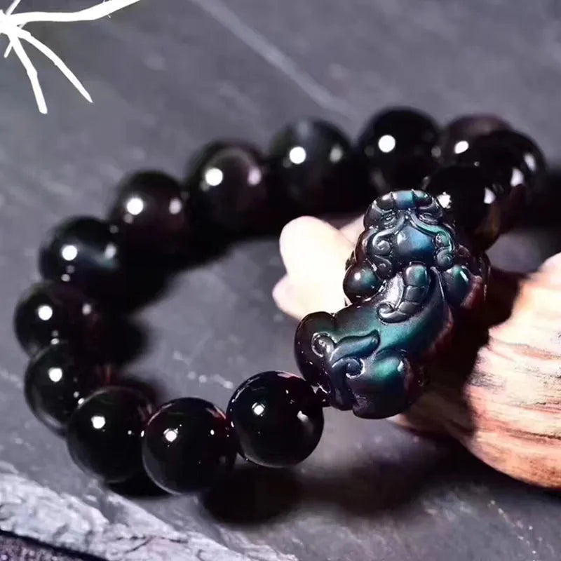 Natural obsidian eye crystal bracelet showing characteristic patterning on beads